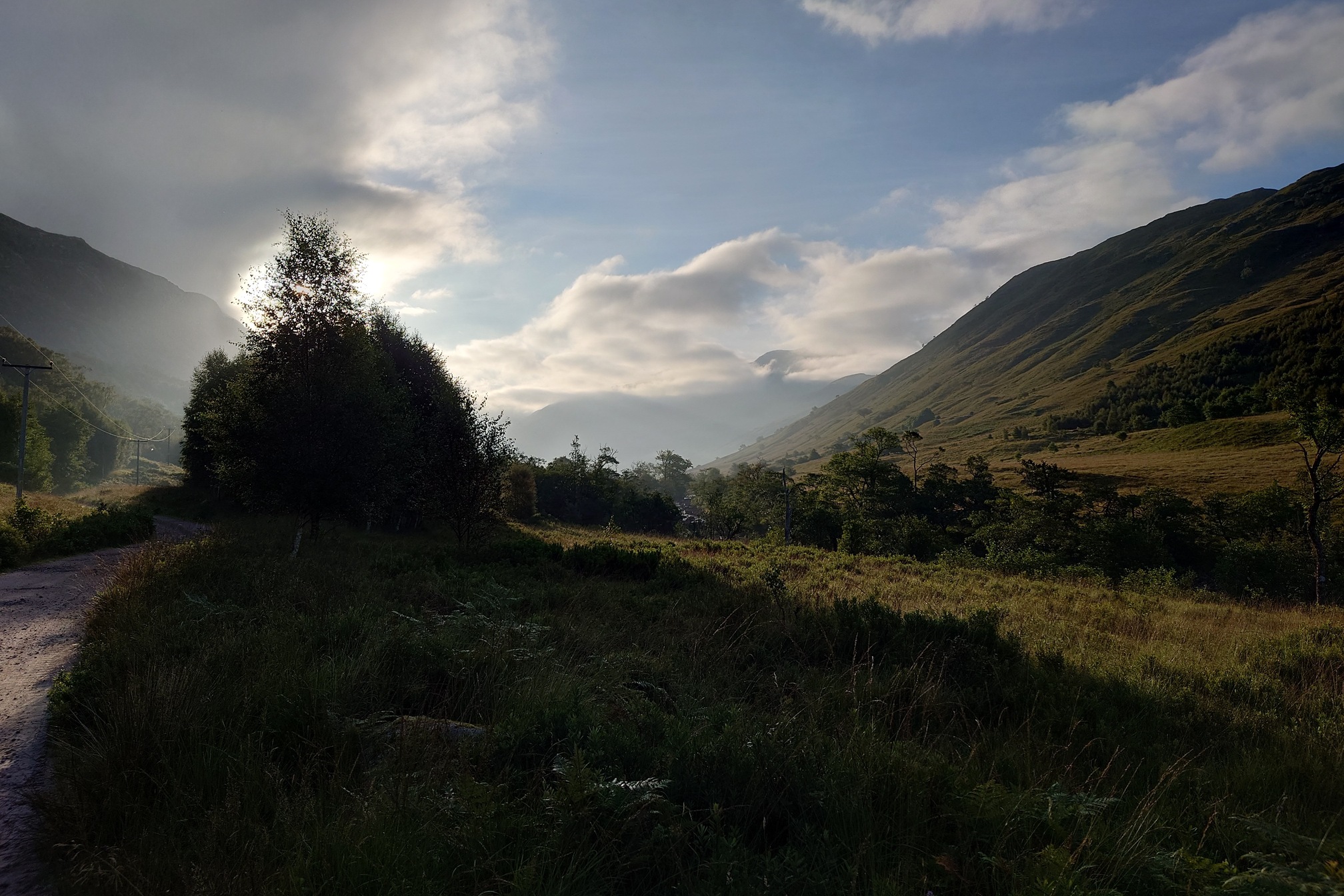 Dawn in the valley, golden light on the hills and long shadows