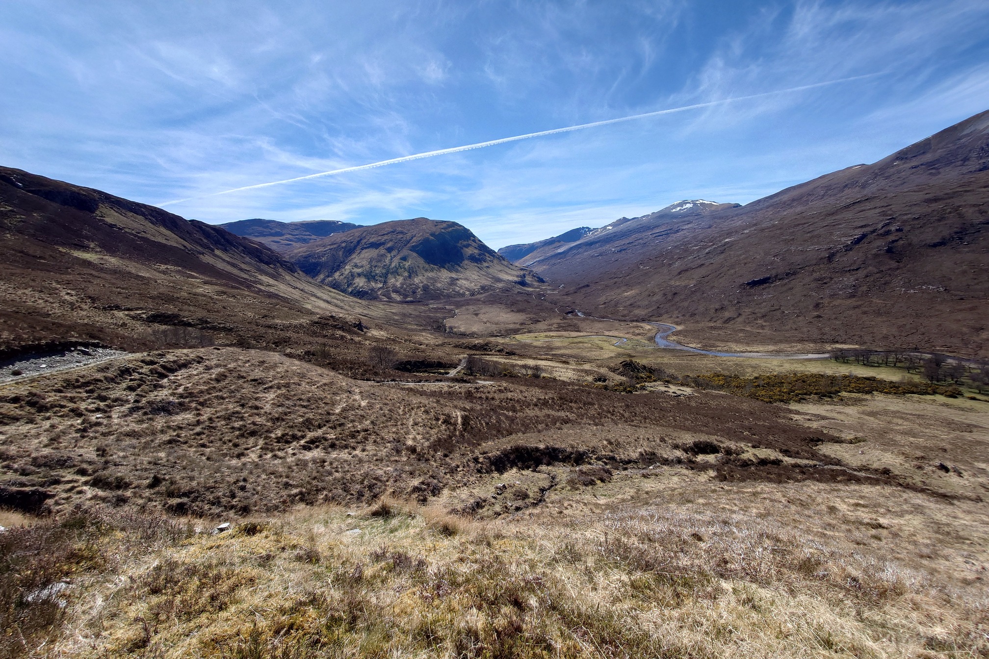 Incredible landscape of brown and yellow heathery mountains under a clear blue sky